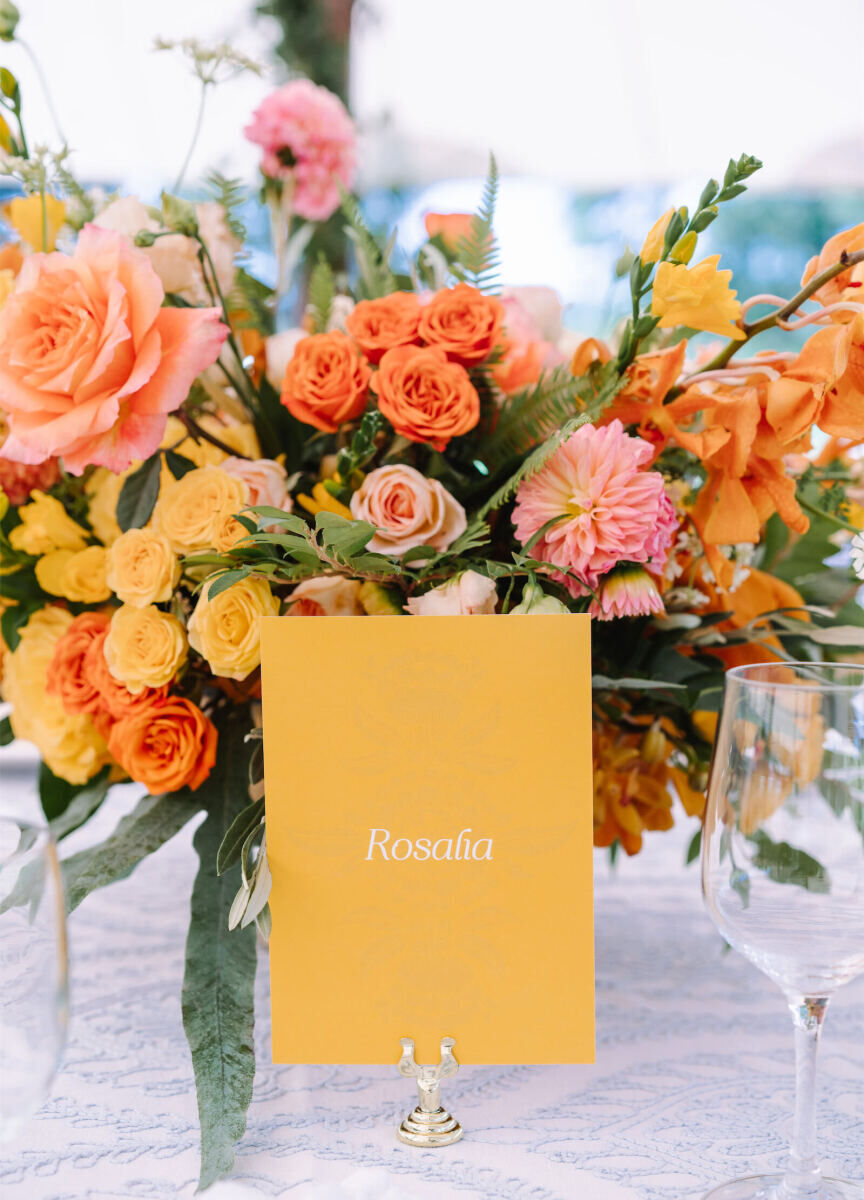 Instead of table numbers, the couple chose to name their tables after musicians they love at an Indian fusion wedding reception.
