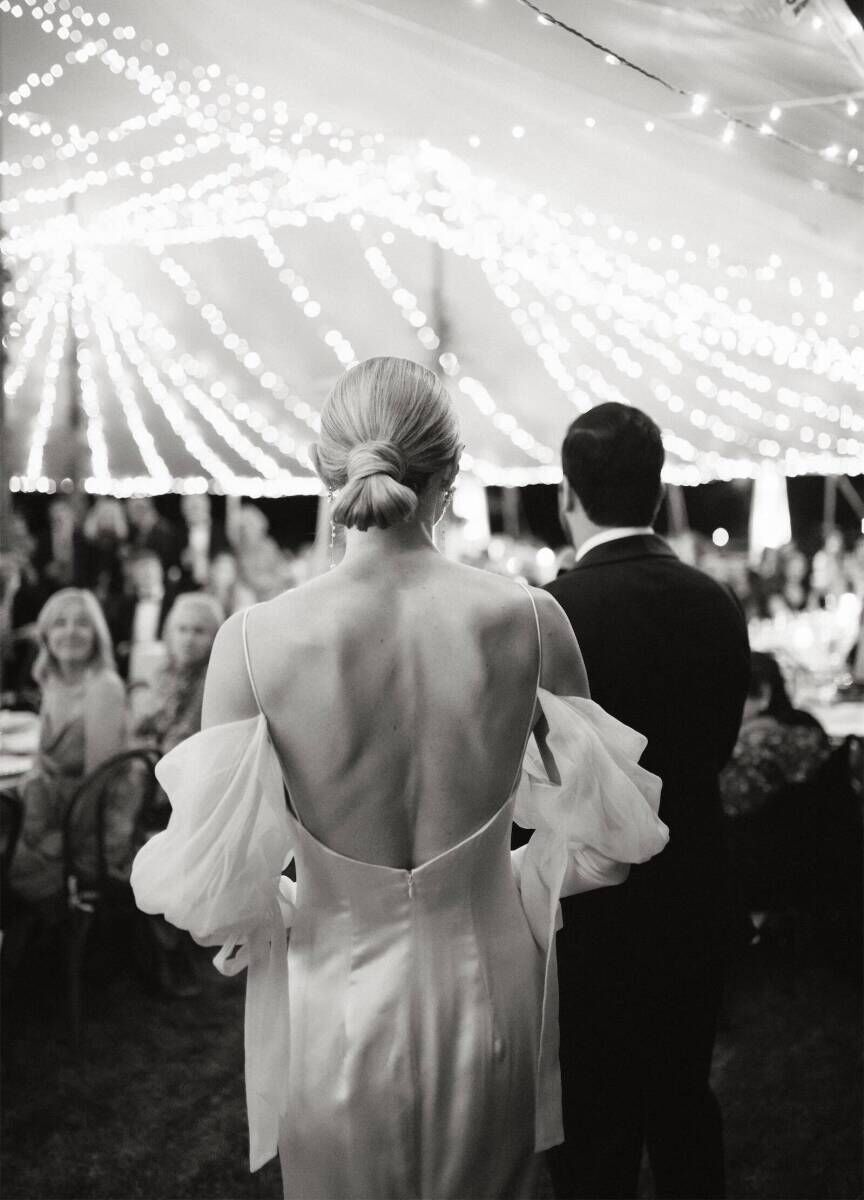 String lights were installed on the inside of a sailcloth tent for an Indian fusion wedding reception that glowed.